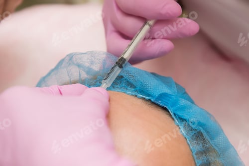 Preview: Procedure Of Hyaluronic Acid Treatment: Cosmetologist Makes The Rejuvenating Facial Injections