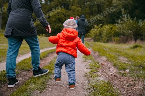 Preview: Mother Walk With Son In The Autumn Park From Behind