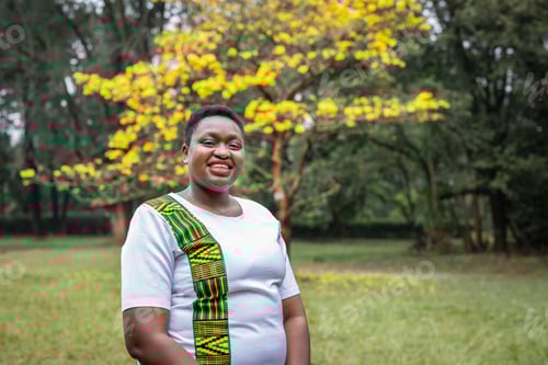 Preview: A Happy Young Woman Living With Hiv Standing In A Park In Nairobi, Kenya
