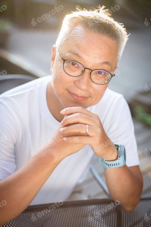 Preview: Portrait Of A Man Living With Hiv Sitting At A Cafe Table