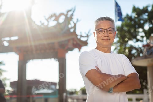 Preview: Man Living With Hiv Standing With Folded Hands Outside A Temple