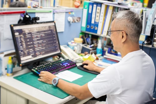 Preview: Man Living With Hiv Working On His Desk In The Office