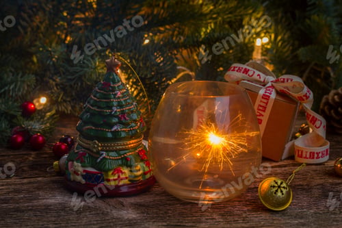 Preview: Christmas Magic Glowing Light With Evergreen Twig On Wooden Background, Low Key