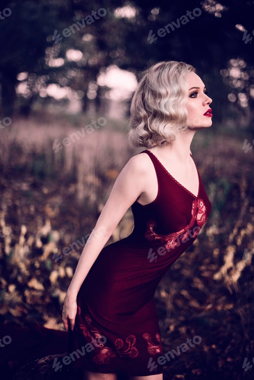 Preview: Beautiful And Elegant Blonde Woman With Red Lips And Hair Waves Wearing Wine Red Nightie Posing On