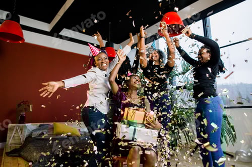 Preview: Happy African American Friends Girls Under Falling Confetti At The Birthday Party
