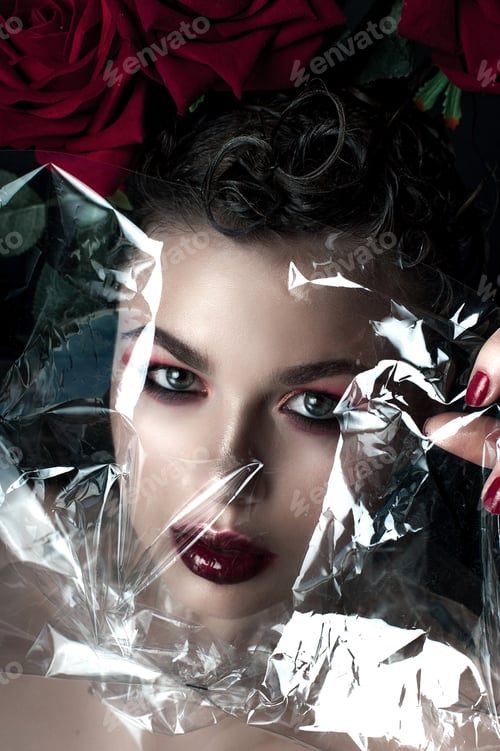 Preview: Beauty Fashion Model Woman Face. Portrait With Red Rose Flowers. Red Lips And Nails. Beautiful
