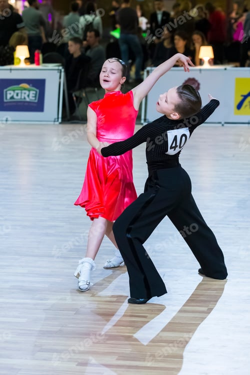 Preview: Riga, Latvia-December 15, 2019: Dance Couple Performs Juvenile Latin American Program On The Wdsf