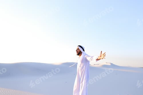 Preview: Stately Young Male Arab Man In Good Mood Conducts Financial Training Of Money, Smiles And Laughs