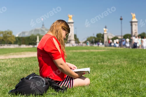 Preview: Lucky Girl Relaxing In The Gardens Next To The Invalides And The Alexander The 3Rd Bridge In Paris