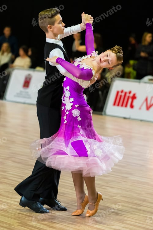 Preview: Riga, Latvia-December 15, 2019: Dance Couple Performs Juvenile European Standard Program On The
