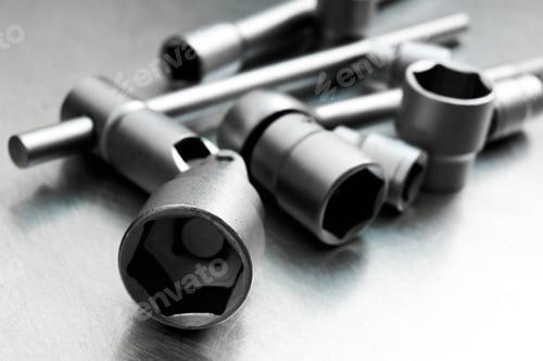 Preview: Metal Tools. Wrench With A Set Of Heads On The Scratched Metal Background.