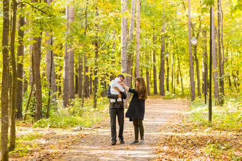Preview: Happy And Young Family Relaxing Together In Golden And Colorful Autum Nature.