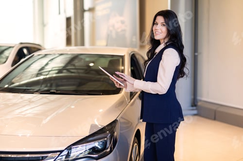 Preview: Stylish Insurance Agent Standing Near The Car And Holding A Tablet