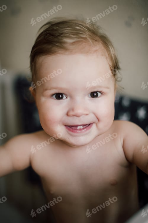 Preview: Baby Boy Sitting In The Crib