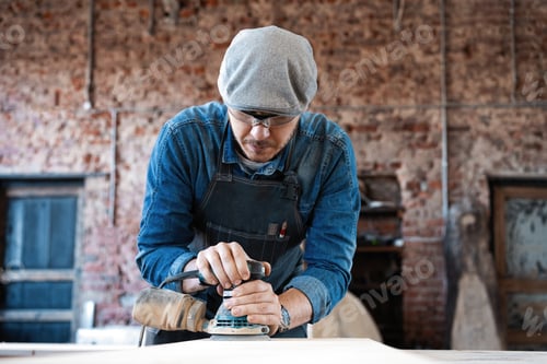 Preview: Young Joiner Work At His Workstation. Successful Handsome Businessman With Stylish Cap Work In