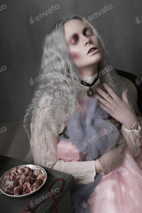 Preview: Dark Halloween Portrait Of Scary Bad Zombie Girl Sitting In A Chair And Collecting Hearts