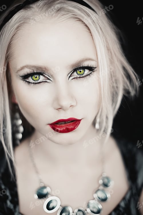 Preview: Beautiful Blond Young Woman With Red Lips And Earrings. Evening Make-Up