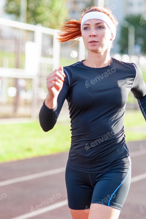 Preview: Fitness And Healthy Lifestyle Concepts. Female Athlete Having Running Exercise Outdoors. Vertical