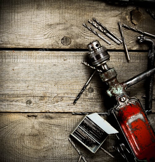 Preview: Old Drill and Drill Bits on Rustic Wood
