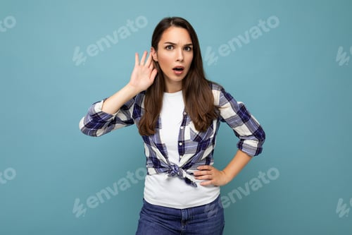 Preview: Young Concentrated Beautiful Brunet Woman With Sincere Emotions Wearing Stylish Check Shirt