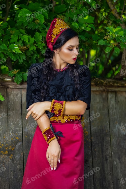 Preview: Glamour Fashion Model In Russian Style Decorated Kokoshnik Posing Outdoors Against Old Wooden
