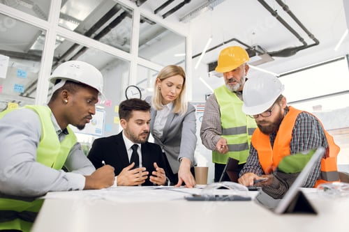 Preview: Concentrated Professional Multiracial Team Of Male And Female Engineers Or Architects