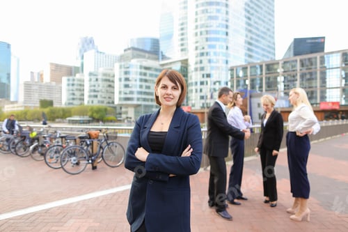 Preview: Gladden Businesswoman Looking At Camera With Close Up Face And Smiling In La Defense Paris. Concept