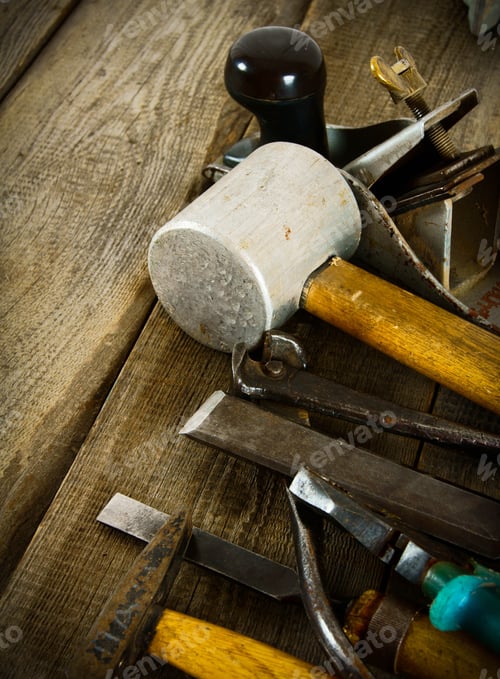 Preview: The Old Working Tool. Many Old Working Tools (Mallet, Plane, Hammer And Others) On A Wooden