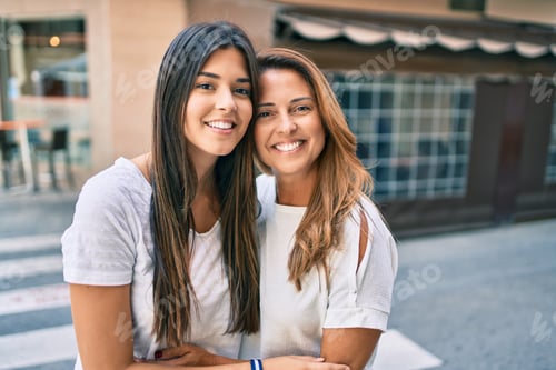 Preview: Beautiful Hispanic Mother And Daughter Smiling Happy Standing At The City.