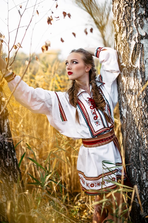 Preview: Young Girl With Pigtails On The Summer Field Near Birch In National Belarus Clothes: White Dress