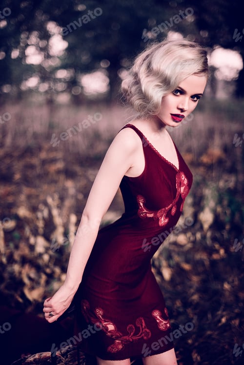 Preview: Beautiful And Elegant Blonde Woman With Red Lips And Hair Waves Wearing Wine Red Nightie Posing On