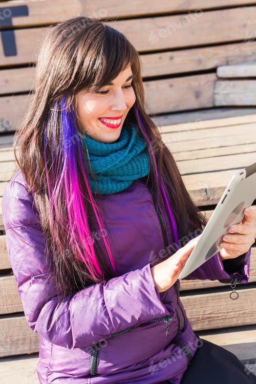 Preview: Technologies, Urban And People Concept - Student Young Woman Reading An Ebook Or Tablet In An Urban
