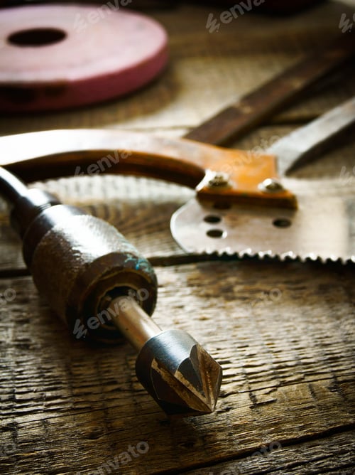 Preview: The Old Working Tool. Many Old Working Tools ( Saw, Plane And Others) On A Wooden Background.