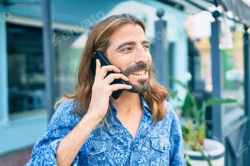 Preview: Young Middle Eastern Man Talking On The Smartphone At The City.