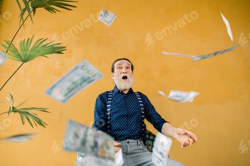 Preview: Studio Portrait Of Excited Joyful Handsome Elderly Man In Stylish Clothes, With Well-Groomed Beard