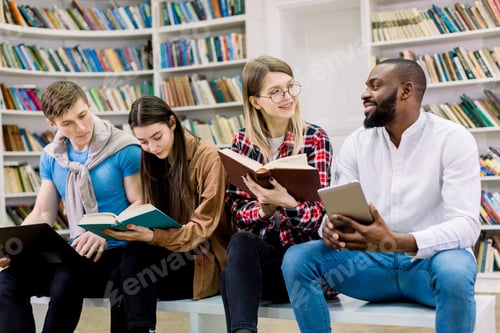 Preview: The Choice Between Paper Books And Education With Electronic Gadgets. Four Multiracial Friends