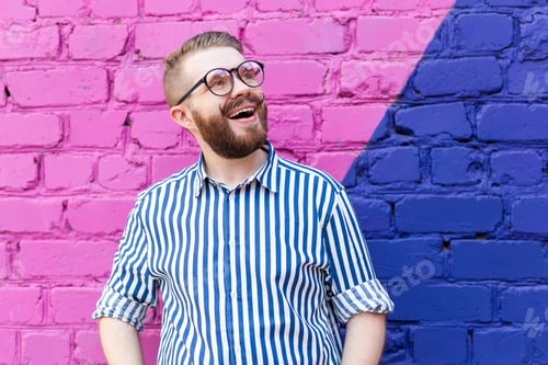 Preview: Portrait Of Cheerful Positive Stylish Student Guy In Glasses With A Mustache And Beard Posing