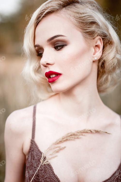 Preview: Beautiful And Elegant Blonde Woman With Red Lips And Hair Waves Wearing Wine Red Nightie Posing On