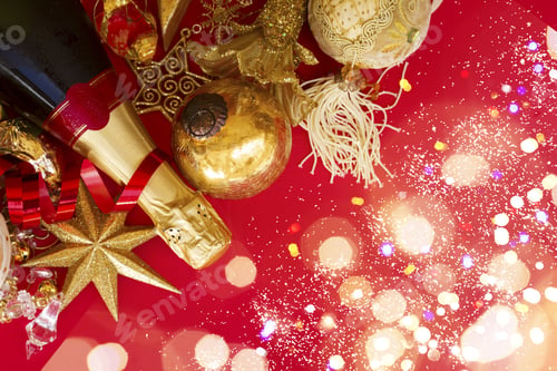 Preview: Christmas Decorations With Bottle Of Champagne On Red Background Flat Lay Scene With With Bokeh