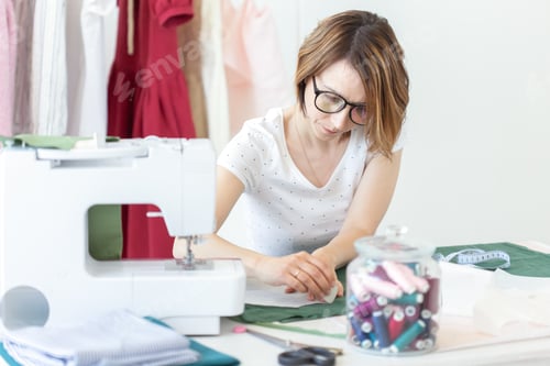 Preview: Young Pretty Girl Student Study At A Clothes Designer In College And Does Her First Thesis Sitting