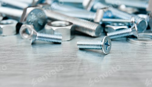 Preview: Metal Style. Fixing Elements. Nuts, Screws And Bolts On Scratched Metal Background.