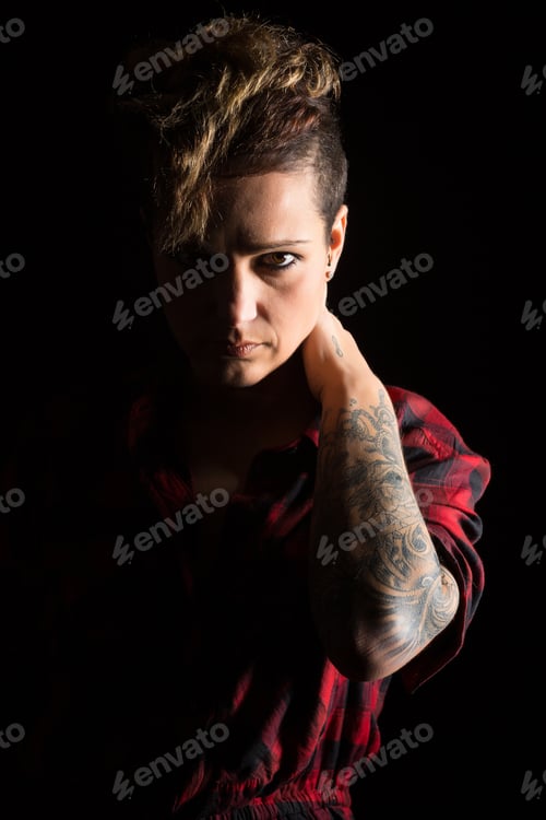 Preview: Studio Shot Of A Young Tattooed Woman