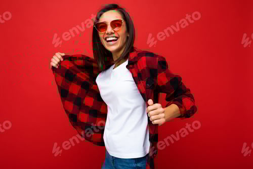 Preview: Smiling Woman Posing with Flannel Shirt on Red Backdrop