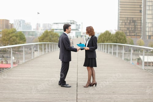 Preview: Man With Smartphone Going Towards Woman With Blue Folder Of Documents, Old It Business Partners