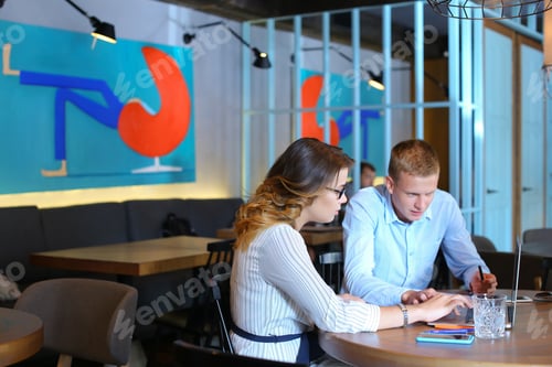 Preview: Smart Young Business Men One Woman Suits Sitting On Table Documents, Graphics, Technology, Leaf