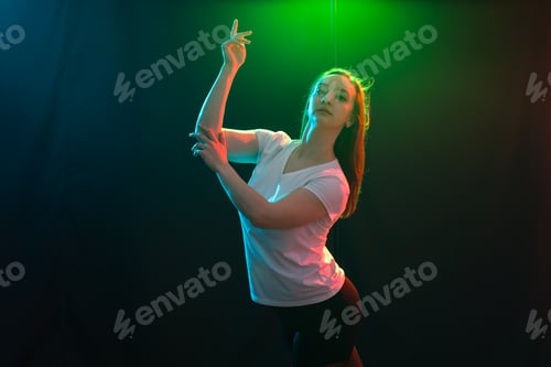 Preview: People And Dancing Concept - Young Fitness Woman Dancing Jazz Funk Over Colored Background