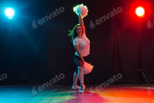 Preview: Cheerleading Young Woman Dancing With Pom-Poms On Colourful Background