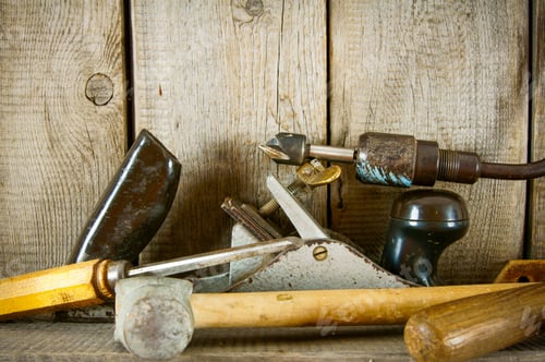 Preview: Old Working Tools. Many Old Tools (Plane, Mallet And Others) On A Wooden Shelf.