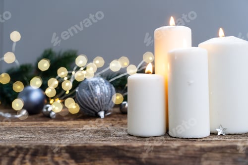 Preview: Candles and Christmas Ornaments on Rustic Wood