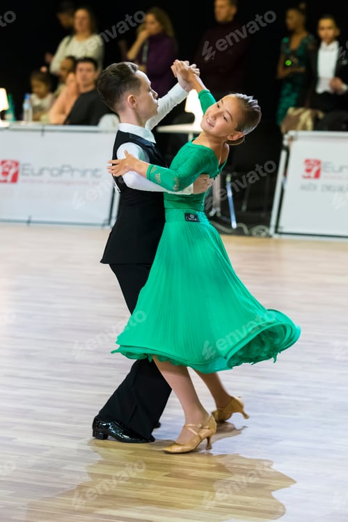 Preview: Riga, Latvia-December 15, 2019: Dance Couple Performs Juvenile European Standard Program On The